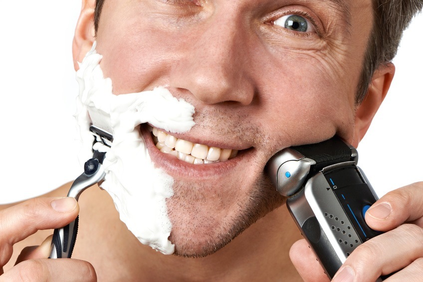 Man Shaving With Two Razors