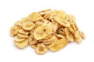 a pile of banana chips on a white background